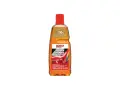 En flaska Sonax Car Wash Shampoo Concentrate, en orange vätska med röd kork. Perfekt för att skapa mycket skum vid biltvätt.