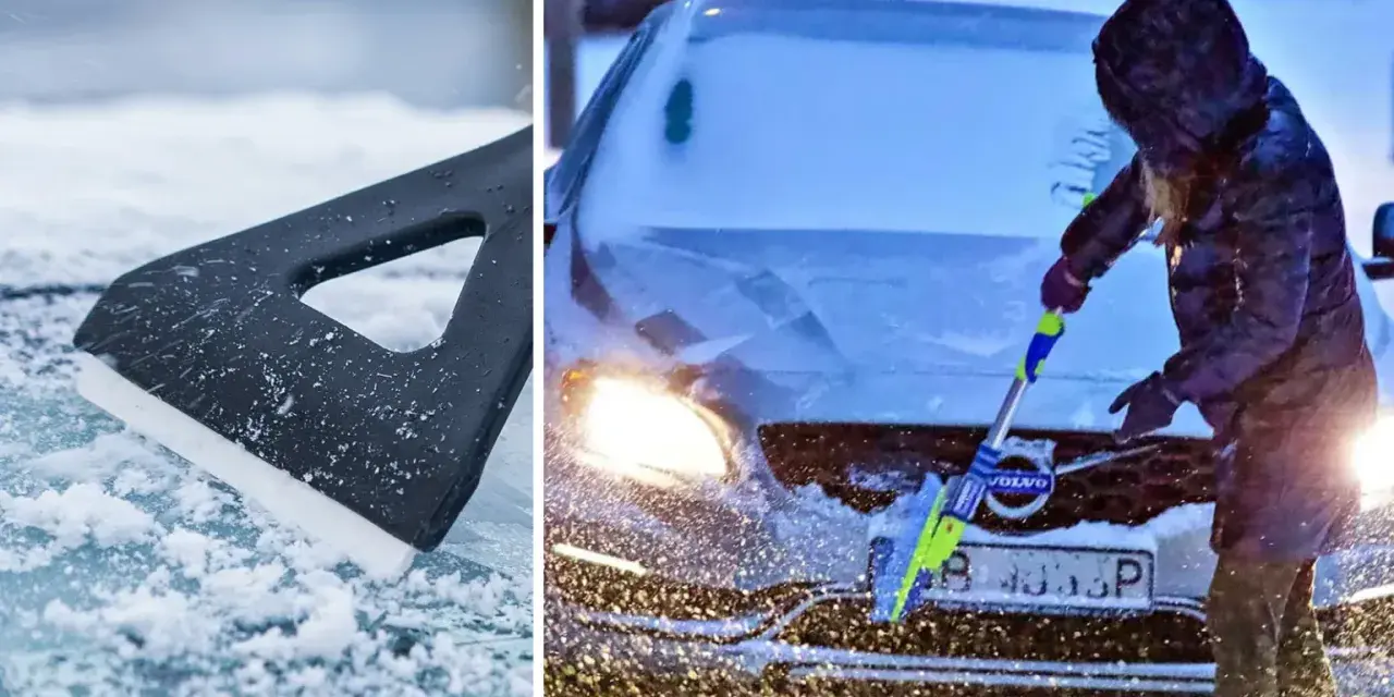 En person med huva skrapar rutan på en Volvo i snöstorm. En isskrapa ligger på isig mark.