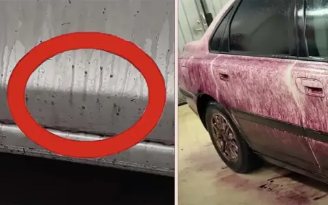 Bilens sida täckt av lila vätska, en flygrostlösare som visar sin effekt.