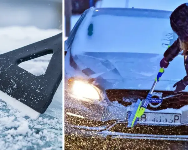 En person med huva skrapar rutan på en Volvo i snöstorm. En isskrapa ligger på isig mark.